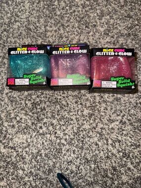 3 Needoh Nice Cube Glitter & Glow Squish Trio - Teal, Purple, Pink